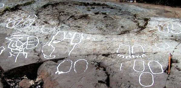 Footprint in rock art symbolizing entrance to the underworld, near a fire pit, Sweden